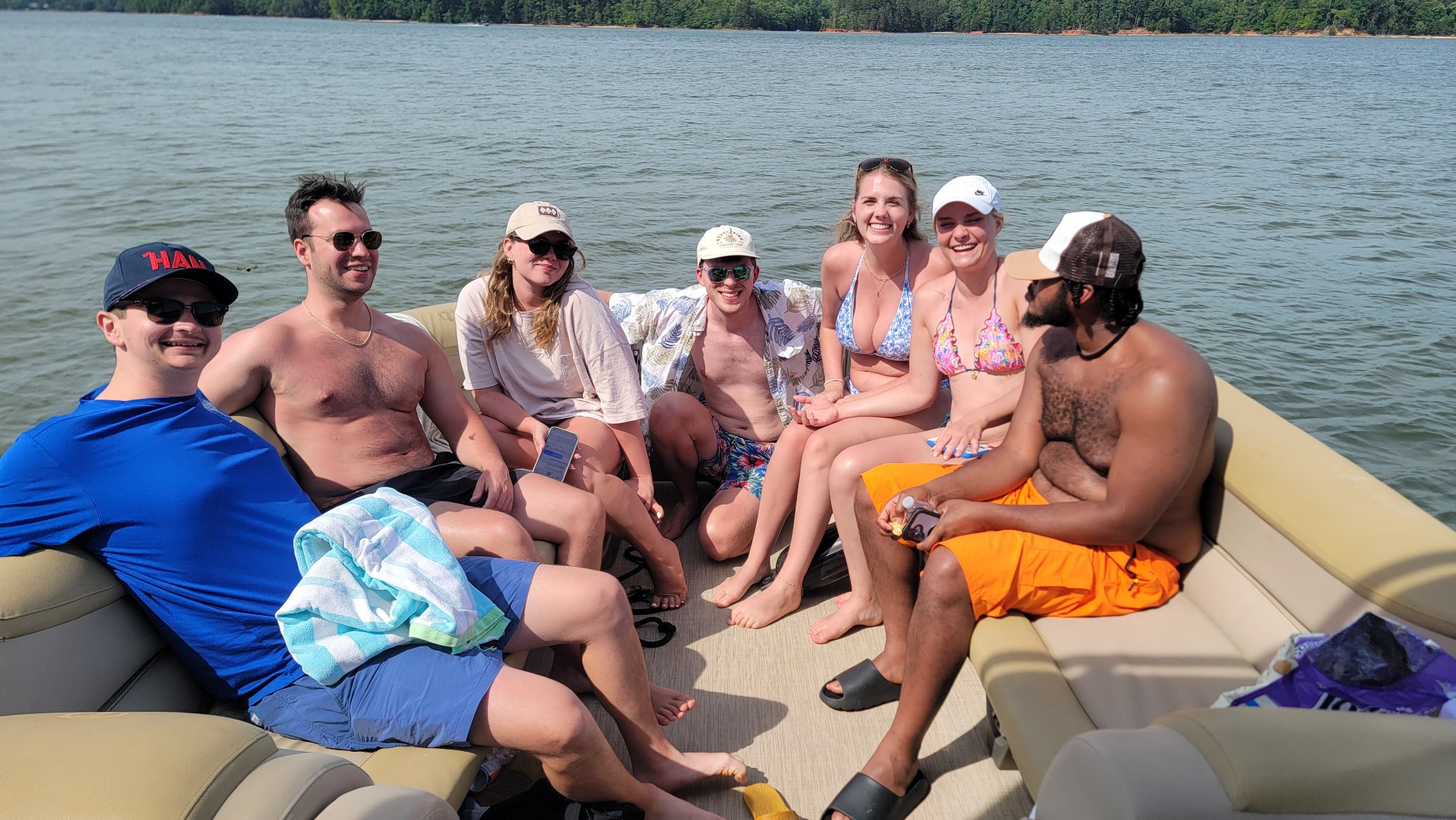 Guests lounging on a pontoon on Lake Norman